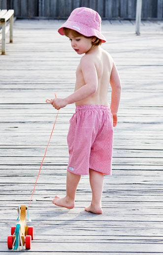 Paddle Boys Swimwear - childrens swimwear - gingham swimming trunks - image with toy